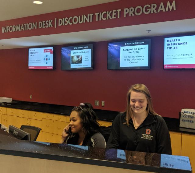 Student employees working at the Information Center in the Ohio Union.